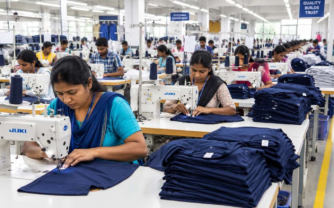 Operators at sewing machines on the stitching floor